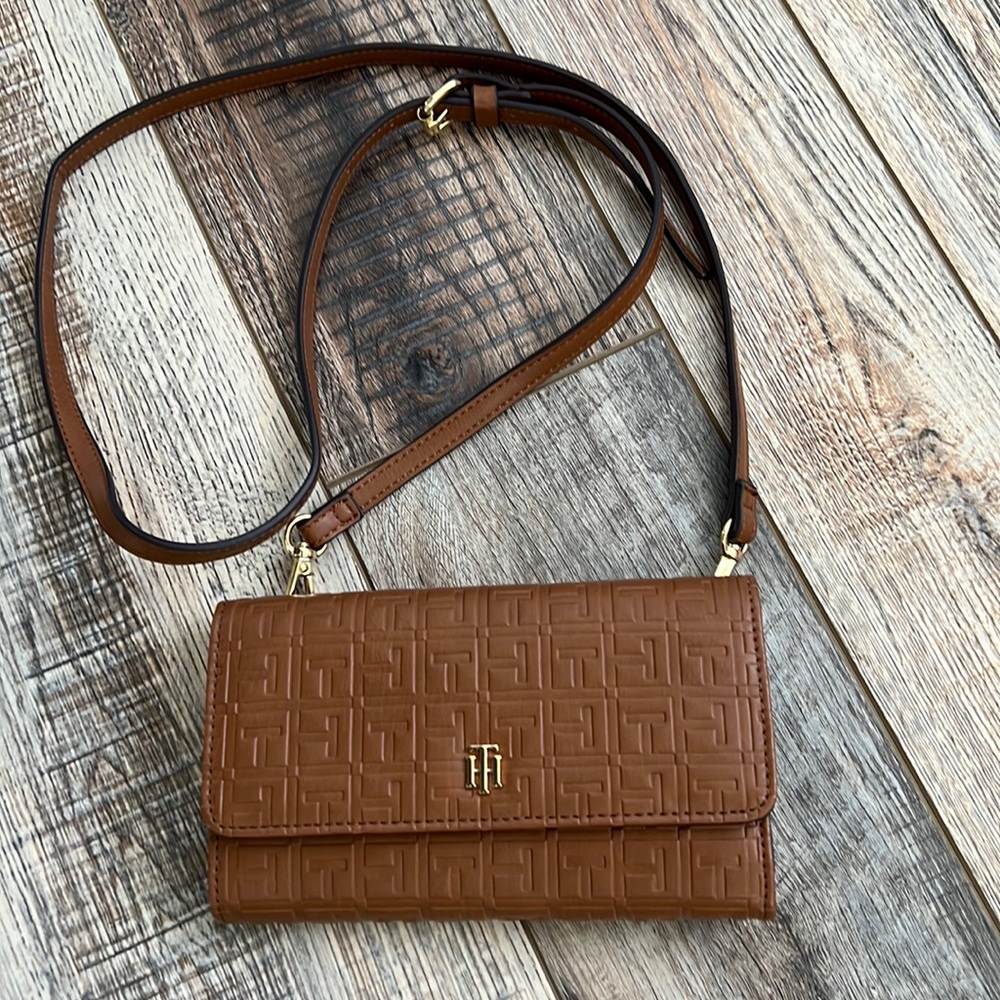 Tommy Hilfiger Crossbody color tan adjustable straps gold accents.